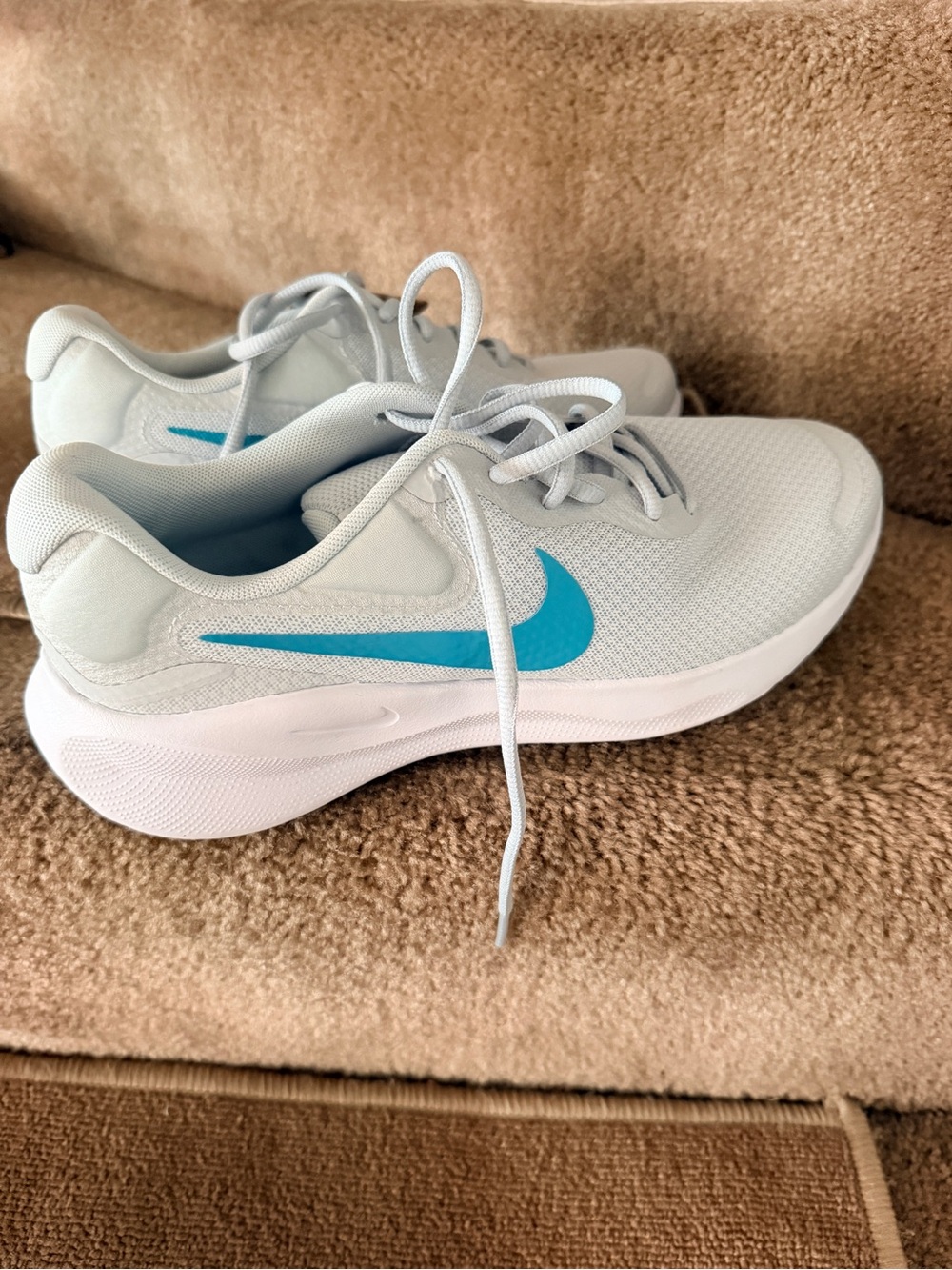 Nike Women's Light Gray Athletic Sneakers with Teal Swoosh
